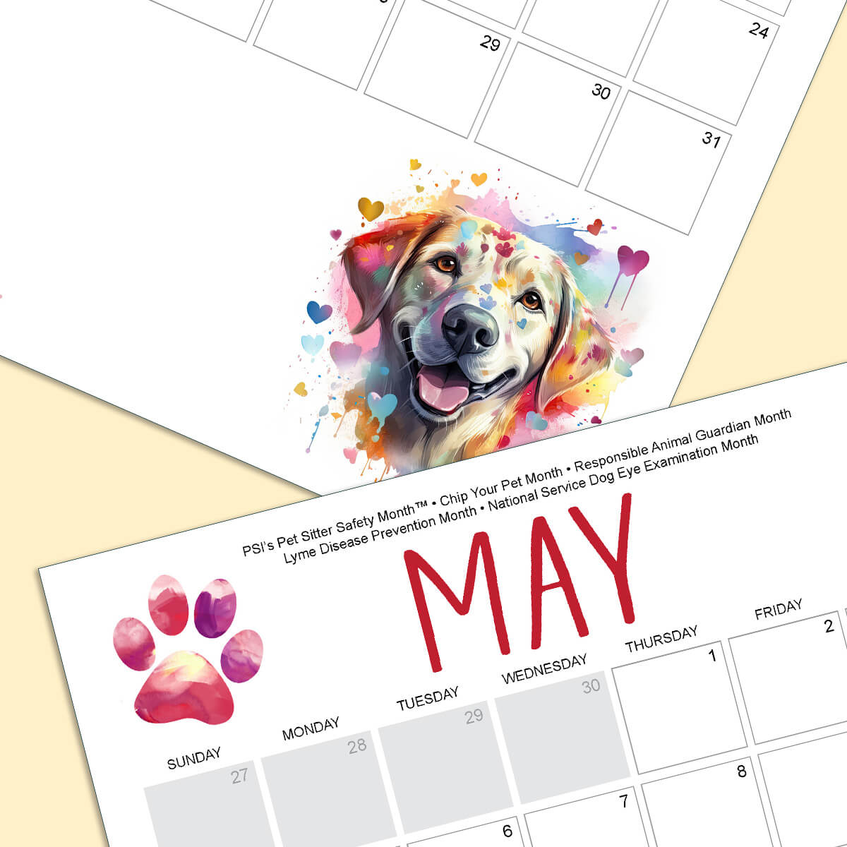 Close up of the calendar, the month of May. A red watercolor paw print and a smiling dog with splashes of colored hearts.